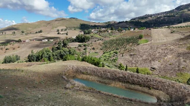Amazing drone video of the Sicilian countryside, near Villa Dafne, an agroturismo acienda, located in the North of Sicily, Italia, during a lovely summer day