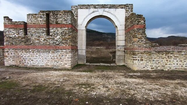 Drone video of Sostra Fortress in March 2019, showing the walls, surrounding ruins, the nearby railway, and tourists exploring the site, Troyan, BG, EU, 02 March 2019