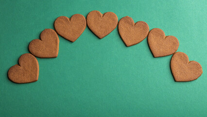 gingerbread hearts on a green background