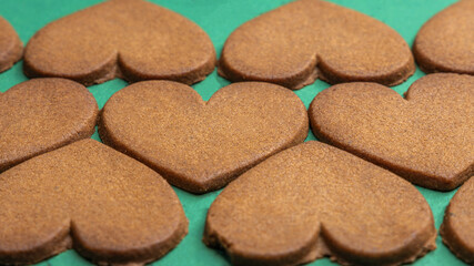 gingerbread hearts on a green background