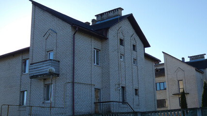 Brick building with unique design located in a residential area during daylight