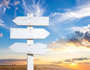 White wooden directional signpost set against a vivid blue sky background