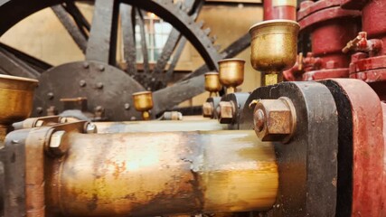 Close-up view of an old hydraulic engine operating outdoors