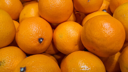 Closeup of ripe oranges forming colorful food texture