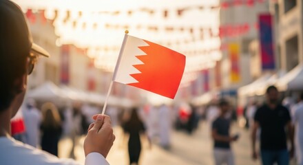 Man Holding Bahrain Flag at Festival or Market During Golden Hour