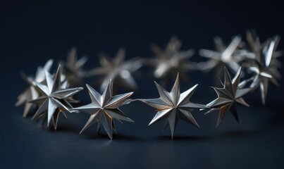 A silver star brooch with a black background