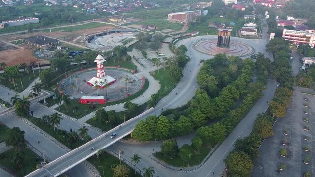 Aerial view of the Tuah Himba tower and the Kutai Kartanegara Bentong clock beside the highway in the afternoon, East Kalimantan, July 26, 2024, Indonesia