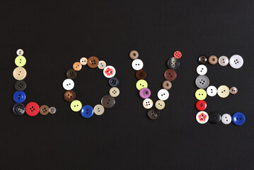 Colorful buttons arranged to create the word love
