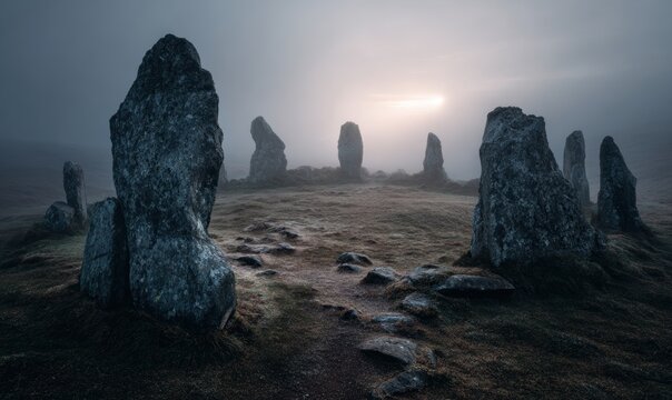 A group of large rocks are in a field