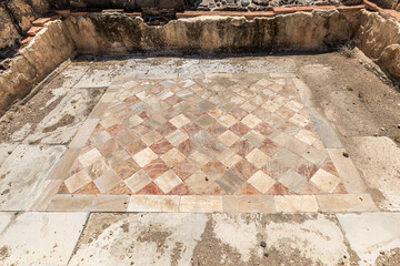 Marble floor with two alternating colors in diamond shapes at at Beit She'an ancient ruins in Israel.
