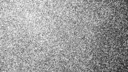 High-contrast fine grain texture with a left-to-right gradient of dense black speckles on a transparent background.