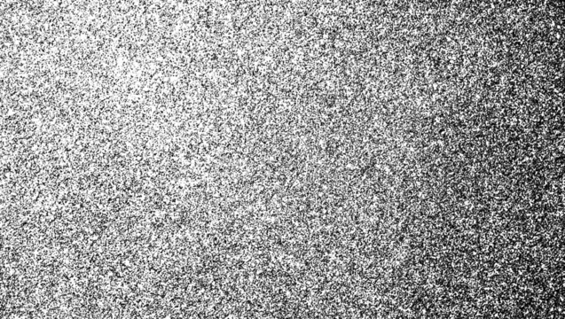 High-contrast fine grain texture with a left-to-right gradient of dense black speckles on a transparent background.