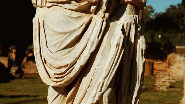 A headless statue in Ostia Antica, the old port of Rome, Lazio, Italy, dating back to the 7th century BC