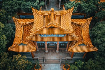 Aerial View of Traditional Chinese Architecture Surrounded by Lush Greenery.