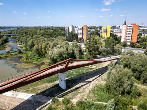 Warsaw, Poland - August 1, 2024: Pedestrian and bicycle footbridge over Vistula River in Warsaw city, Poland