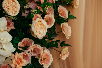 a floral arrangement made of environmentally friendly materials for the interior of a festive event, wedding, or presentation. A photo area with artificial roses