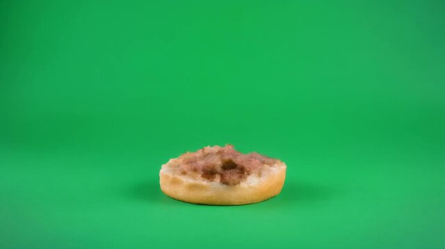 Delicious burger on a plain green background