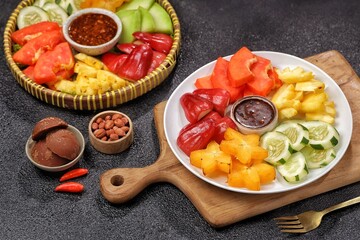 Rujak buah. Fruit Rujak or Indonesian fruit salad is a fresh fruit dish enjoyed with addictive peanut sauce.