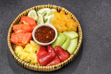 Rujak buah. Fruit Rujak or Indonesian fruit salad is a fresh fruit dish enjoyed with addictive peanut sauce.