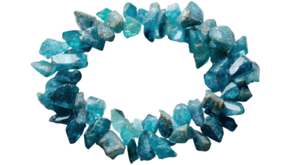 Natural raw blue crystal fragments arranged in a circular shape, forming a frame with copy space, transparent background