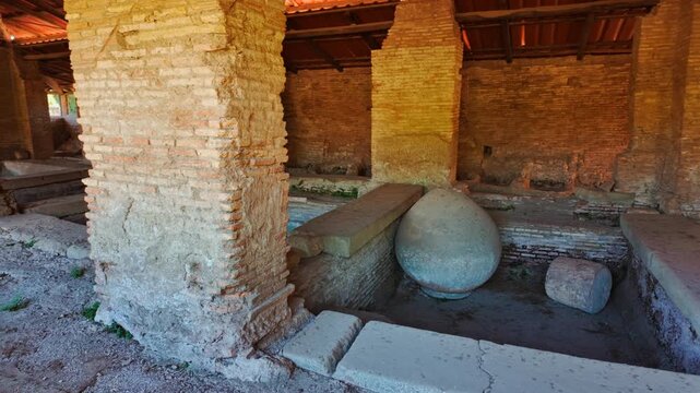 Fullonica, a ancient laundry or fullery, located in Ostia Antica, the old port of Rome, Lazio, Italy, dating back to the 7th century BC