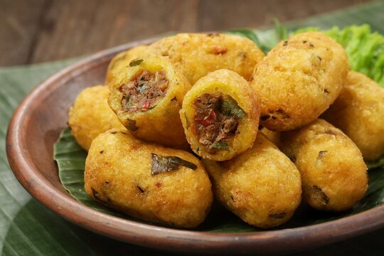 Combro is made from grated cassava which is shaped round or oval and filled with oncom and chili sauce and then fried.