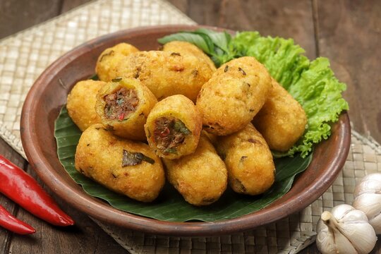 Combro is made from grated cassava which is shaped round or oval and filled with oncom and chili sauce and then fried.