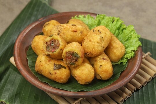 Combro is made from grated cassava which is shaped round or oval and filled with oncom and chili sauce and then fried.