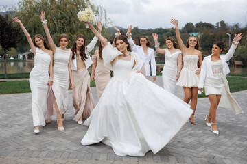 Bridal party celebrates joyful moments during outdoor wedding in beautiful garden setting