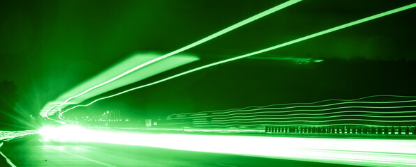 green car lights at night. long exposure