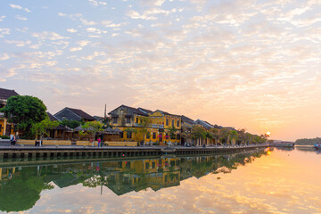 Morning sunrise Hoi An, old houses on the waterfront reflected in the river. Vietnam