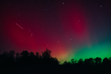 Magical Aurora Colors Above Rural Landscape
