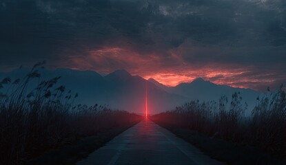A road leads toward a vibrant red light beam piercing a dramatic sunset sky