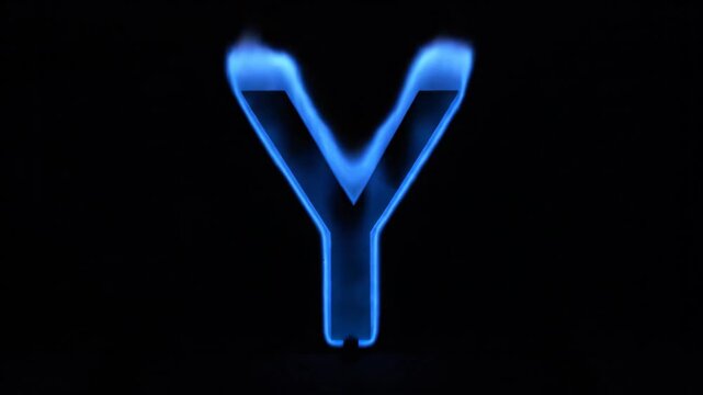 A blue stylized Y is set against a black backdrop its form partially defined by what appears to be blue flame