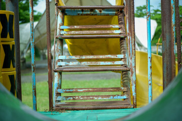 Rusty Metal Staircase On Old Playground Ladder With Weathered Feel And Colorful Background