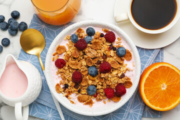 Tasty breakfast. Granola with yogurt and fruits served on white marble table, flat lay