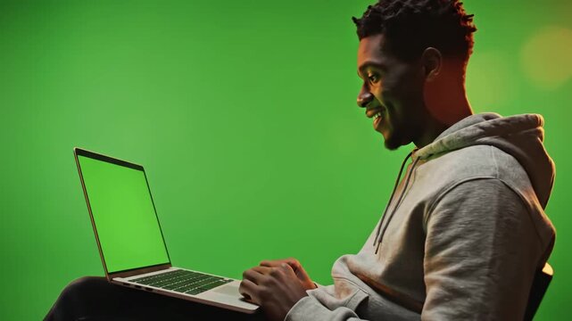 Green Screen young adult analyzing laptop display with in living room using mockup template isolated copy space and blank chrma key background on computer remote school student scene 4 distortion