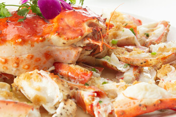 A closeup view of a plate of garlic king crab.