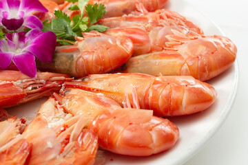 A closeup view of a platter of Chinese steamed shrimp.