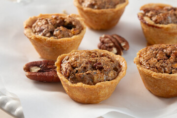 A closeup view of several pecan tarts.