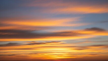 Vibrant sunset sky with glowing orange, yellow, and purple clouds