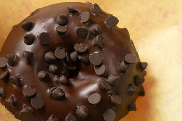A top down view of a chocolate chip donut.
