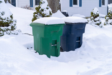 trash bin outdoor in winter blizzard in snow