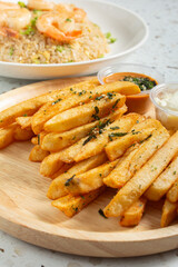 A view of a plate of Asian garlic fries.