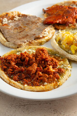 A view of several memelas, on a plate.