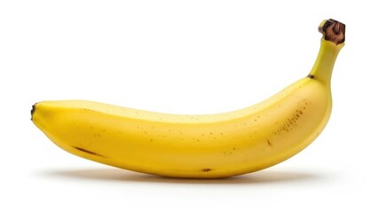 A single ripe yellow banana with a few brown spots, isolated on a clean white background, showcasing its natural curve and stem.