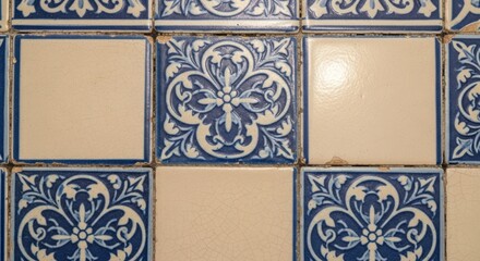 Close-up of blue and white floral patterned ceramic tiles on a wall