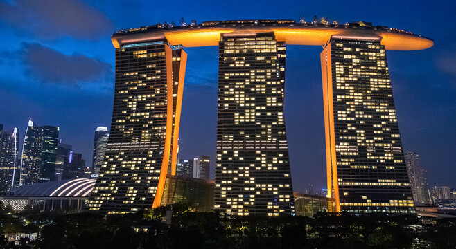 View of the illuminated famous landmark, Marina Bay Sands in Singapore seen a during blue hour evening