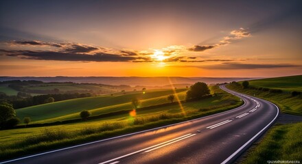 Golden sunset illuminates a winding road through rolling green hills, casting a breathtaking cinematic glow across the picturesque rural landscape at dusk