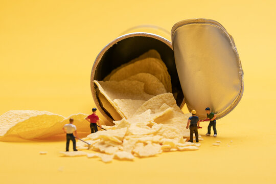 Miniature People On Potato Chips Scene